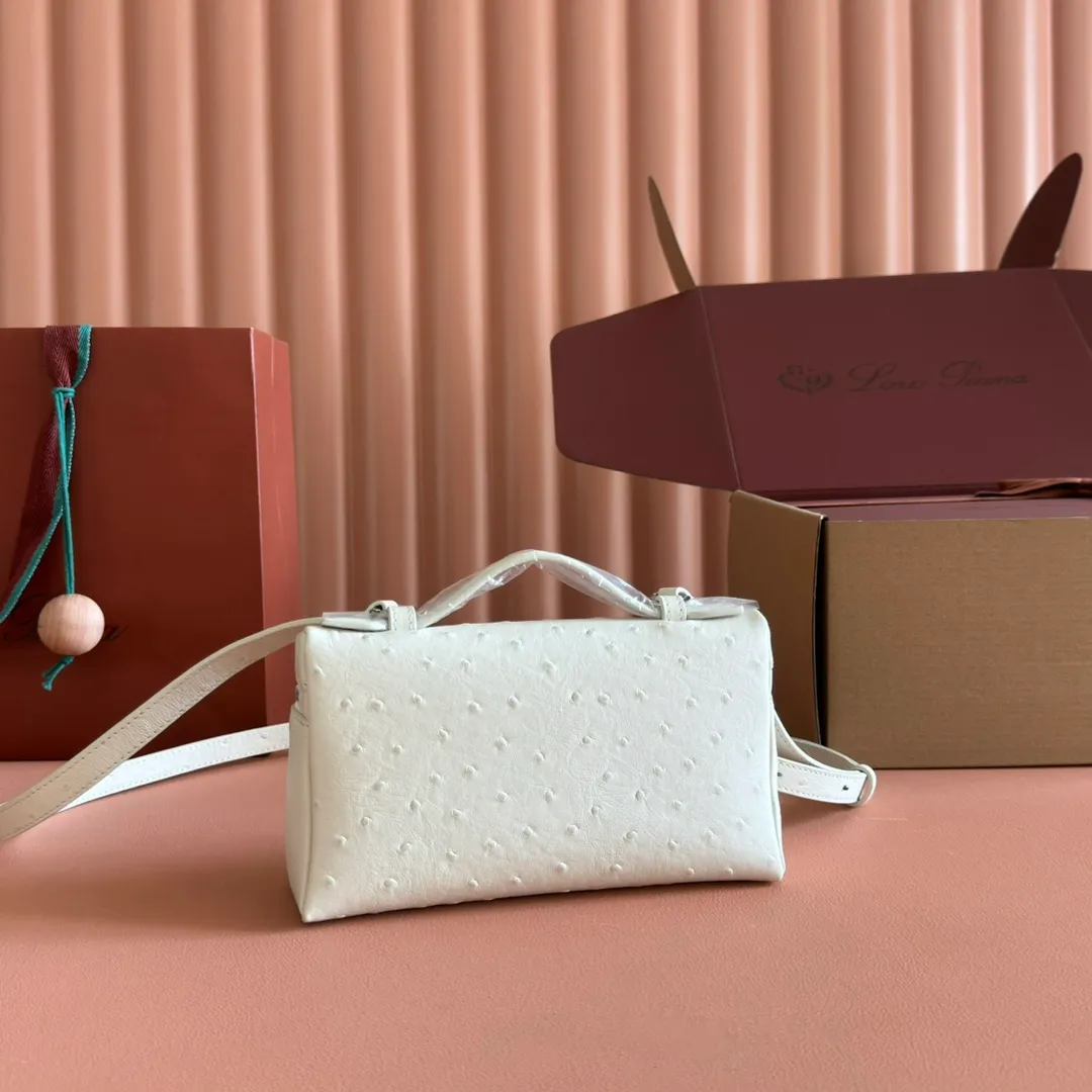p1160💋💋💋【Original leather all-steel configuration counter complete package】 𝐋𝐨𝐫𝐨 𝐏𝐢𝐚𝐧@ Extra pocket L19 series handbag/crossbody bag The most comfortable life is when it is not defined, just like loro The material design of pian@ does not require complicated design styles. The simple and soft outline is elegant and durable, like an exquisite cosmetic case, which perfectly balances appearance and functionality. The leather is delicate and feels as soft as butter. The small bag has a large capacity. It is not only portable with a thin shoulder strap, but can also be worn cross-body. Sisters who have a special liking for minimalist style can buy it. It is simple and versatile. The simpler, the more different. Stars and Instagram celebrities are all planting it. There are two sizes of 19 cm and 27 cm. One is exquisite and casual, and the other is elegant and grand. Size: Small: length 19×width 7×height 12cm (